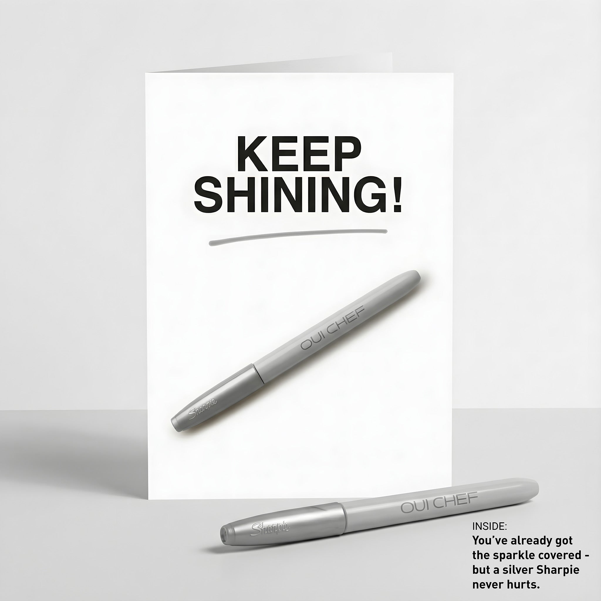 Oui Chef "Keep Shining" Greeting card standing against a white background with a sharpie placed beside it.