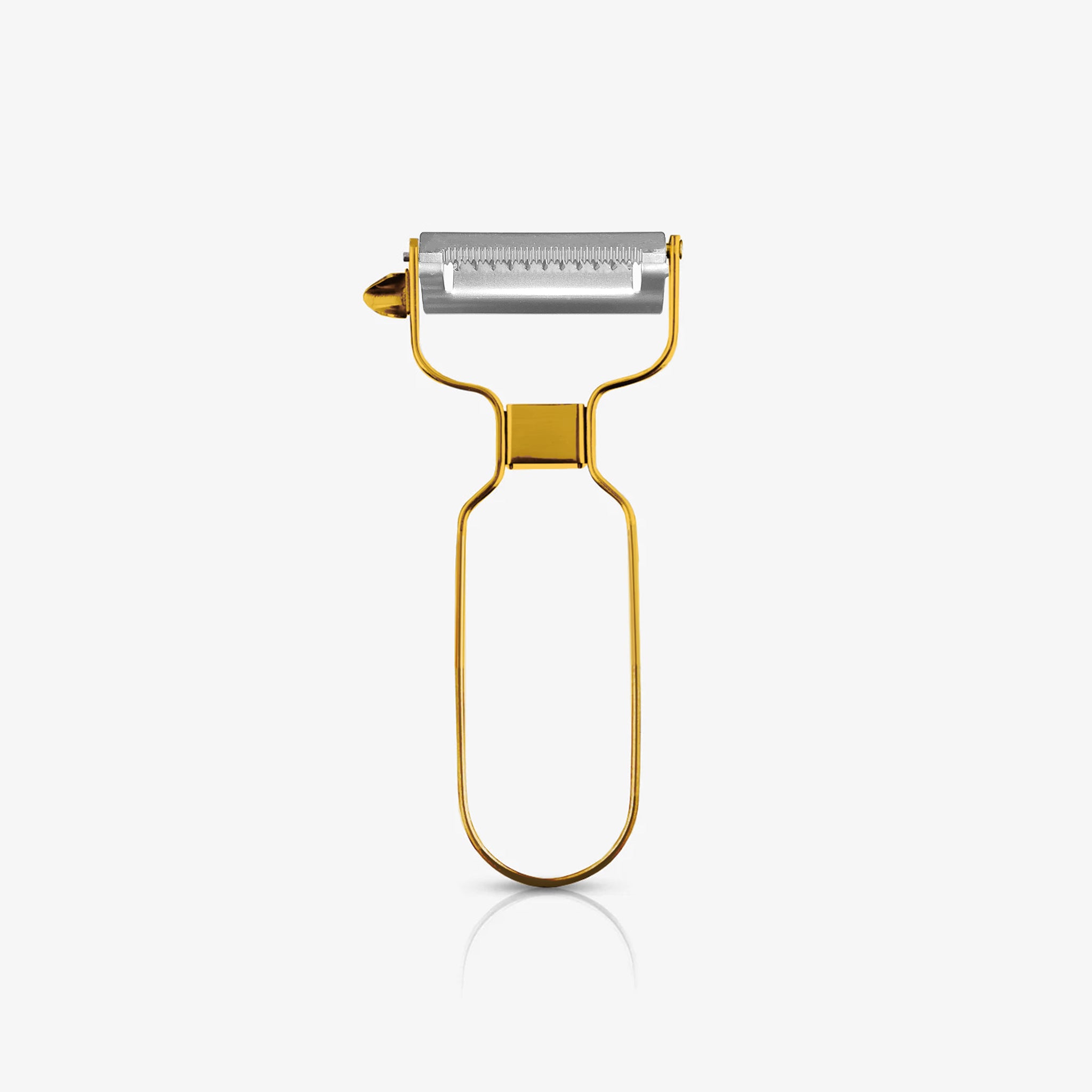 A gold stainless steel julienne peeler standing upright on an off-white background, featuring a sleek metal handle and sharp serrated blade for creating thin vegetable strips.