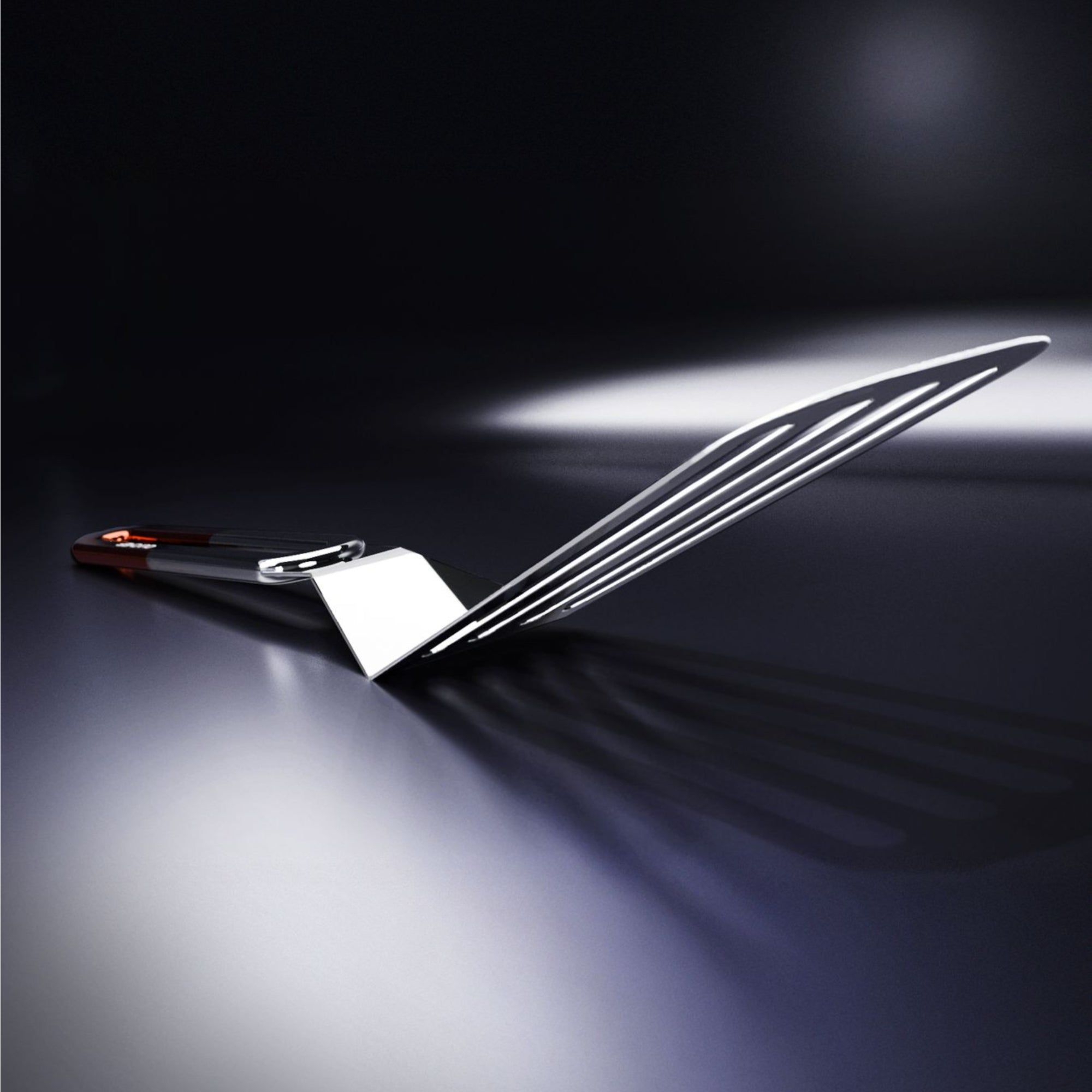 A 3D image of a stainless steel slotted spatula with a copper coloured handle against a white background.