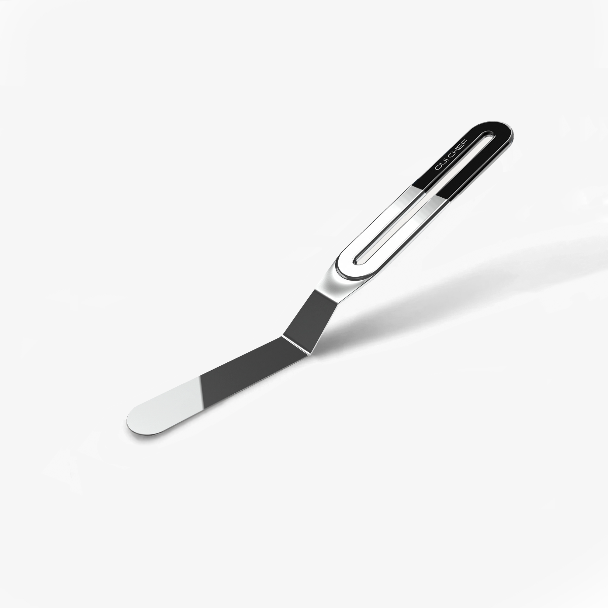 A small stainless steel palette knife with a black top handle with the "Oui Chef" logo engraved, sitting against a white background. 