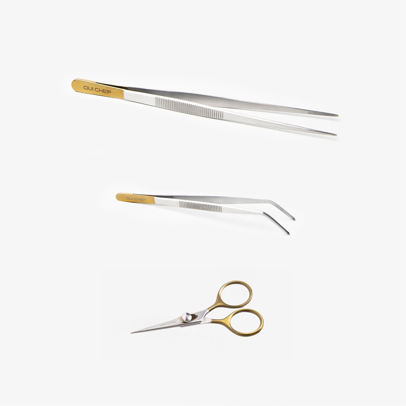 Three precision hand tools with gold-toned handles and silver stainless steel blades, including two pairs of tweezers and a small pair of scissors, arranged on a clean white background.
